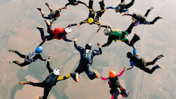 group of people skydiving together